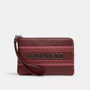 Coach Corner Zip Wristlet Wine with COACH Embossed in Black on the Front